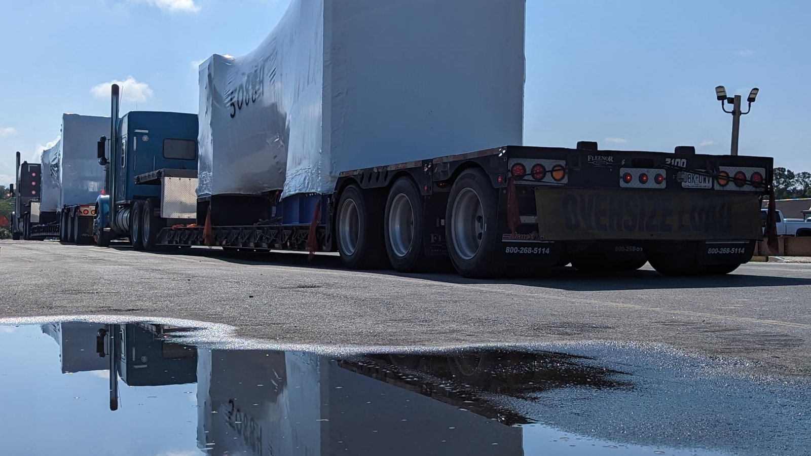 Large industrial shrink wrapped cargo on a trailer